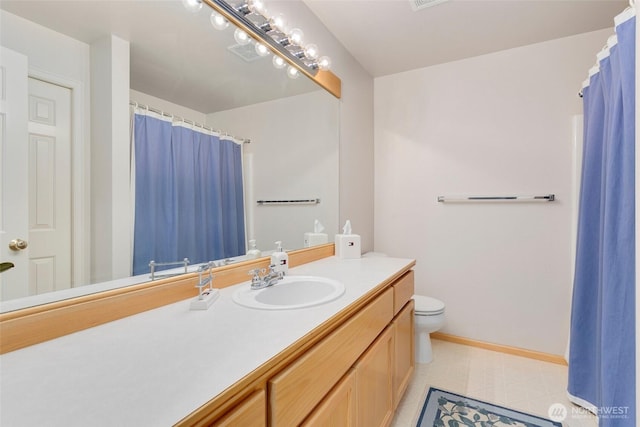 15831 Manion Way NE, Duvall, WA 98019 - full bath featuring vanity, toilet, tile patterned floors, baseboards, and curtained shower