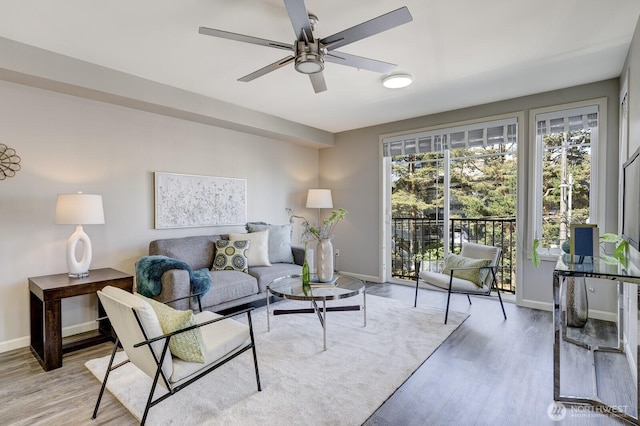 124 Bellevue Ave E Unit 305, Seattle, WA 98102 - living area with baseboards, a ceiling fan, and wood finished floors