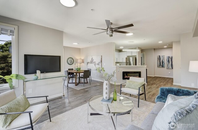 124 Bellevue Ave E Unit 305, Seattle, WA 98102 - living room featuring light wood-style floors, baseboards, a ceiling fan, and recessed lighting