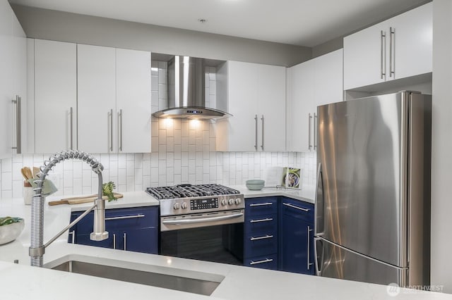 124 Bellevue Ave E Unit 305, Seattle, WA 98102 - kitchen featuring stainless steel appliances, wall chimney range hood, and light countertops