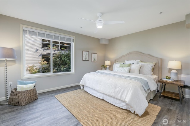 124 Bellevue Ave E Unit 305, Seattle, WA 98102 - bedroom featuring wood finished floors, baseboards, and ceiling fan