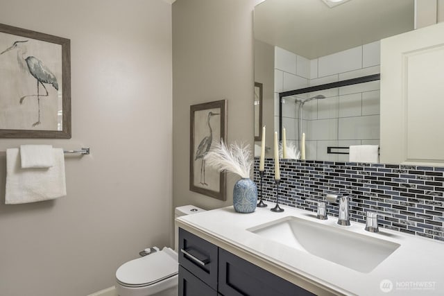 124 Bellevue Ave E Unit 305, Seattle, WA 98102 - bathroom with toilet, vanity, a stall shower, and tasteful backsplash