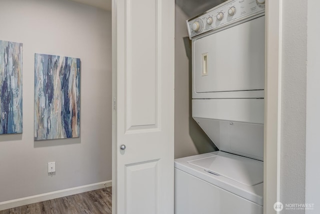 124 Bellevue Ave E Unit 305, Seattle, WA 98102 - washroom with stacked washer / drying machine, wood finished floors, and baseboards
