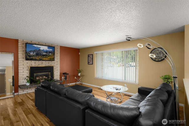 33046 38th Ave SW, Federal Way, WA 98023 - living room with a textured ceiling, wood finished floors, and a brick fireplace
