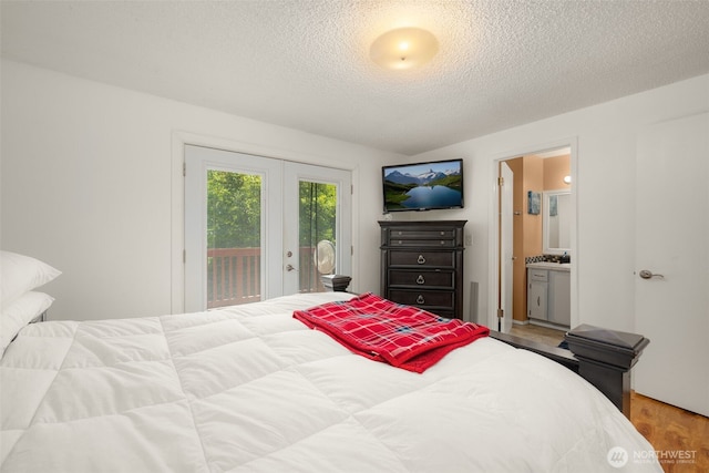 33046 38th Ave SW, Federal Way, WA 98023 - bedroom with access to outside, a textured ceiling, wood finished floors, and connected bathroom