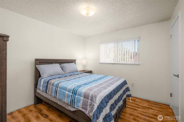 33046 38th Ave SW, Federal Way, WA 98023 - bedroom with wood finished floors and a textured ceiling