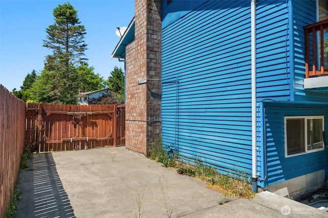 33046 38th Ave SW, Federal Way, WA 98023 - view of side of property with a patio area and a chimney