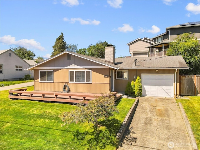8828 S K St, Tacoma, WA 98444 - view of front of house with a chimney, concrete driveway, a garage, and roof with shingles
