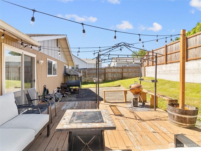 8828 S K St, Tacoma, WA 98444 - wooden terrace featuring an outdoor fire pit
