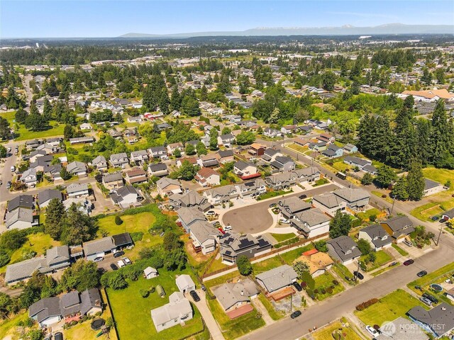 8828 S K St, Tacoma, WA 98444 - aerial overview of property's location featuring nearby suburban area and mountains