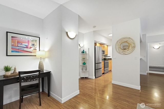 2331 42nd Ave SW Unit 206, Seattle, WA 98116 - hall with light wood finished floors and baseboards