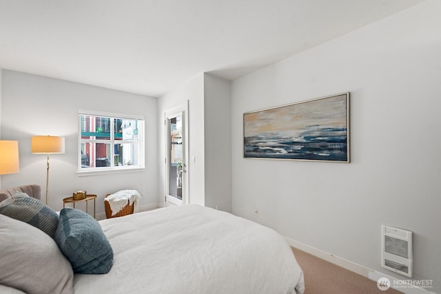 2331 42nd Ave SW Unit 206, Seattle, WA 98116 - bedroom featuring heating unit, carpet flooring, and baseboards
