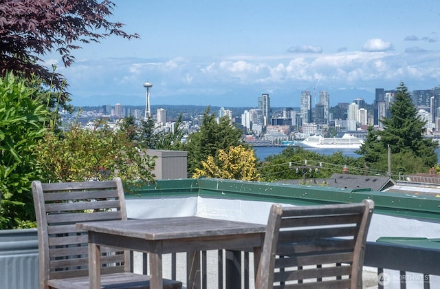 2331 42nd Ave SW Unit 206, Seattle, WA 98116 - wooden terrace with a view of skyline