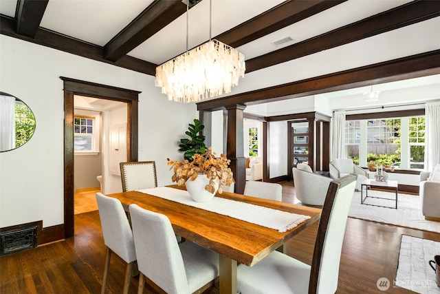 106 W Mcgraw St, Seattle, WA 98119 - dining area featuring beamed ceiling, wood finished floors, plenty of natural light, a chandelier, and ornate columns
