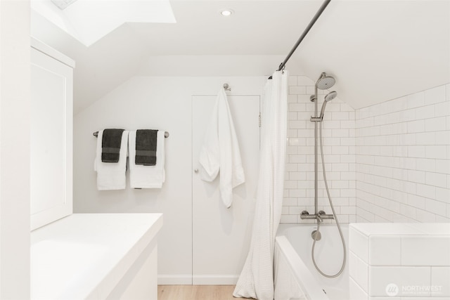106 W Mcgraw St, Seattle, WA 98119 - bathroom with shower / bathtub combination with curtain, vaulted ceiling, recessed lighting, wood finished floors, and vanity