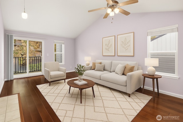 11113 NE 125th Ln Unit E-319, Kirkland, WA 98034 - living room featuring wood finished floors, lofted ceiling, a ceiling fan, and baseboards