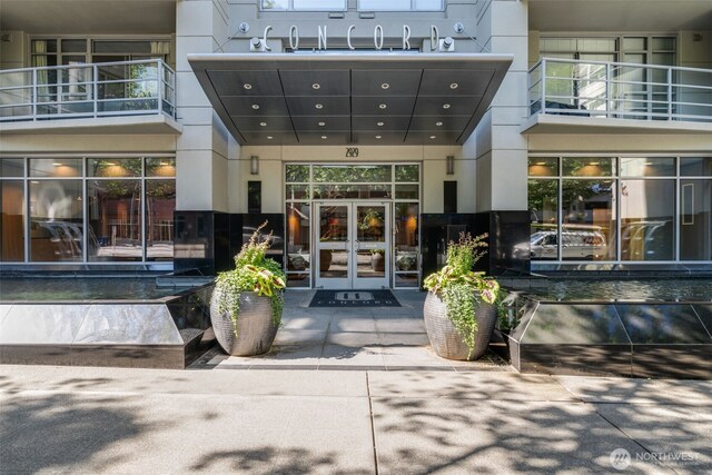 2929 1st Ave Unit 319, Seattle, WA 98121 - view of exterior entry featuring french doors and stucco siding