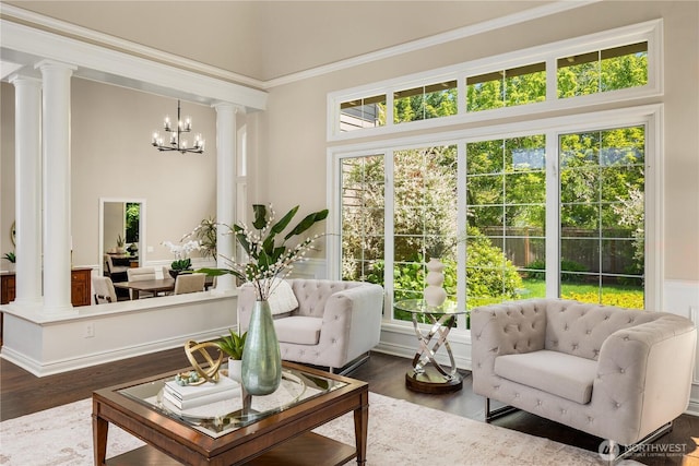 2260 269th Ct SE, Sammamish, WA 98075 - living room with ornate columns, a chandelier, and dark wood-style floors