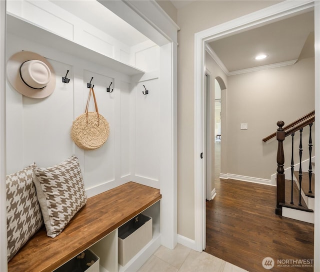2260 269th Ct SE, Sammamish, WA 98075 - mudroom featuring ornamental molding, arched walkways, and baseboards