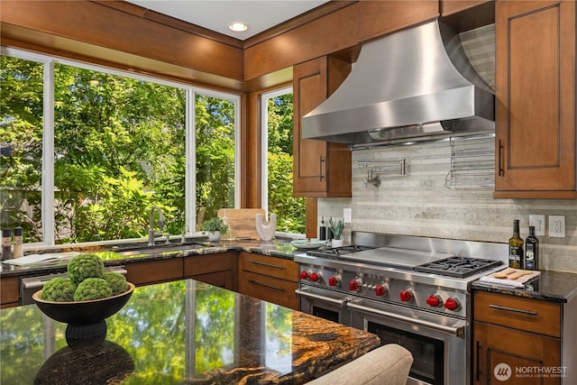 2260 269th Ct SE, Sammamish, WA 98075 - kitchen with double oven range, wall chimney exhaust hood, a sink, brown cabinets, and backsplash