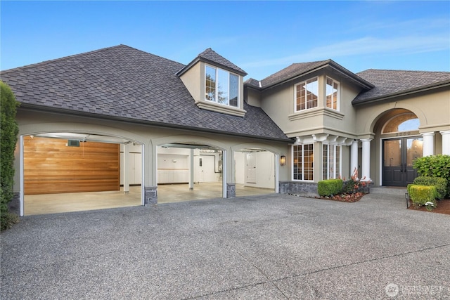 2260 269th Ct SE, Sammamish, WA 98075 - view of front of home featuring asphalt driveway, roof with shingles, an attached garage, and stucco siding