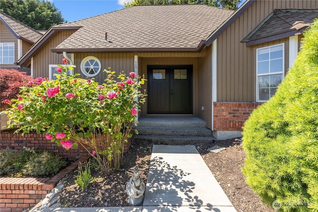 18620 29th Ave SE, Bothell, WA 98012 - view of exterior entry with a shingled roof and brick siding