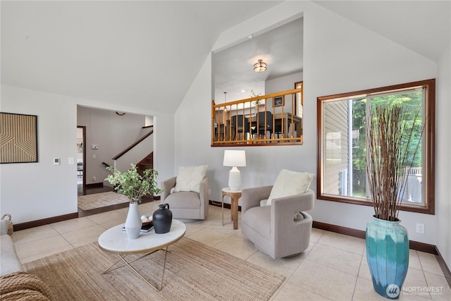 18620 29th Ave SE, Bothell, WA 98012 - living area with lofted ceiling, stairway, tile patterned floors, and baseboards