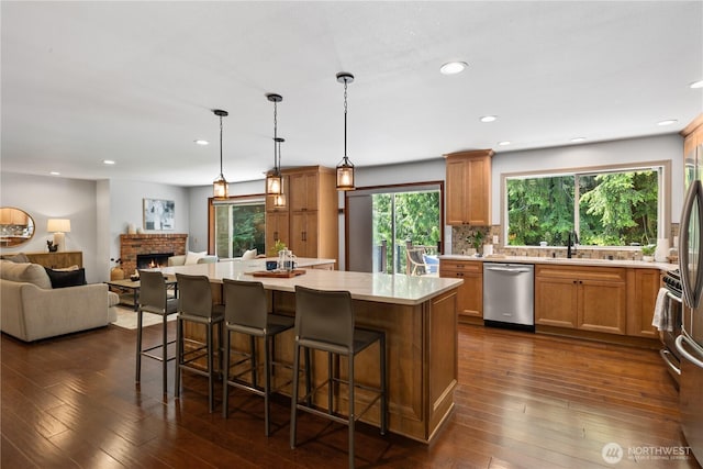 18620 29th Ave SE, Bothell, WA 98012 - kitchen with dishwasher, open floor plan, a kitchen island, light countertops, and a sink