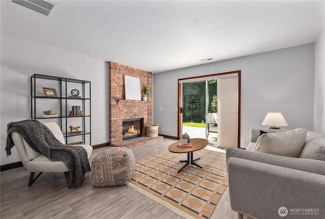 18620 29th Ave SE, Bothell, WA 98012 - living room featuring a fireplace, wood finished floors, and baseboards