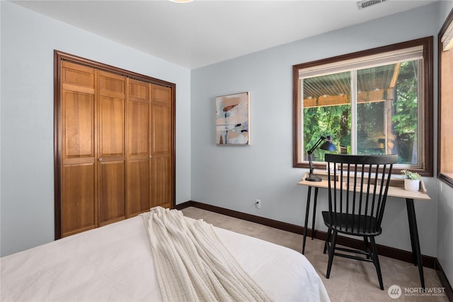 18620 29th Ave SE, Bothell, WA 98012 - bedroom featuring light colored carpet, baseboards, and a closet
