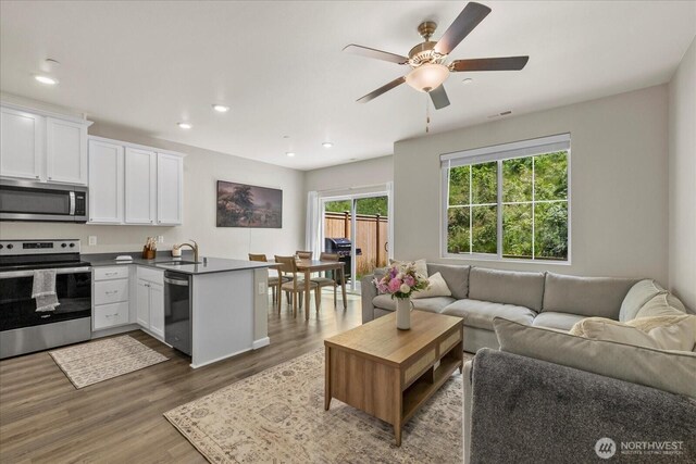 8603 E Gilman Ave, Arlington, WA 98223 - living area with wood finished floors, ceiling fan, and recessed lighting
