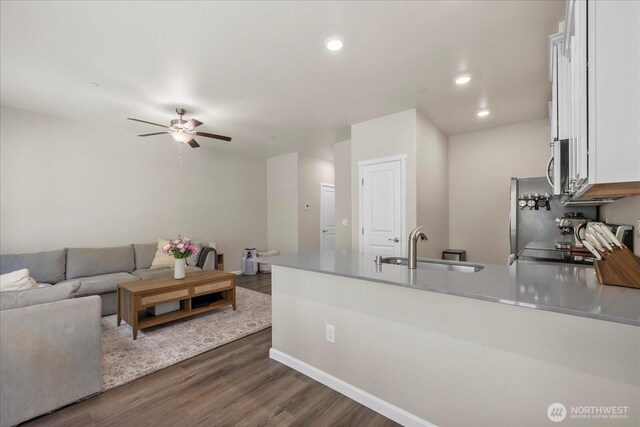 8603 E Gilman Ave, Arlington, WA 98223 - living room featuring dark wood-style flooring, ceiling fan, recessed lighting, and baseboards