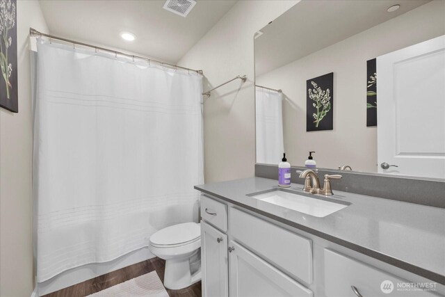 8603 E Gilman Ave, Arlington, WA 98223 - bathroom featuring vanity, toilet, wood finished floors, and recessed lighting