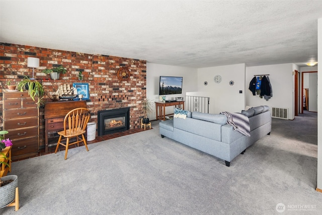 17464 Dunbar Rd Unit 1, Mount Vernon, WA 98273 - carpeted living area with a textured ceiling and a fireplace