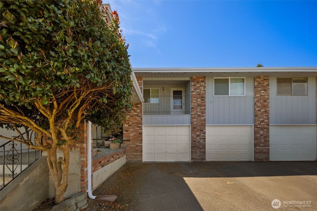 17464 Dunbar Rd Unit 1, Mount Vernon, WA 98273 - townhome / multi-family property with brick siding, driveway, and a garage