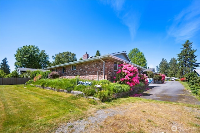 17464 Dunbar Rd Unit 1, Mount Vernon, WA 98273 - view of property exterior with a chimney and brick siding