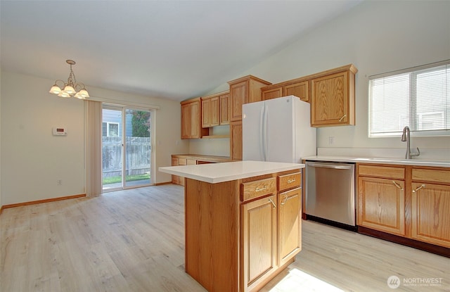 712 SE 5th Way, Battle Ground, WA 98604 - kitchen featuring dishwasher, freestanding refrigerator, vaulted ceiling, a sink, and light wood-style flooring