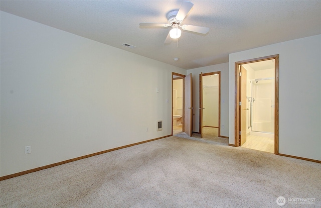 712 SE 5th Way, Battle Ground, WA 98604 - unfurnished bedroom featuring light carpet, ensuite bathroom, baseboards, a walk in closet, and a closet