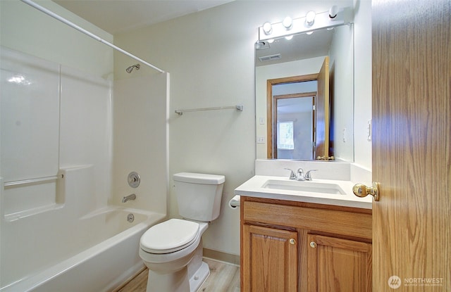 712 SE 5th Way, Battle Ground, WA 98604 - full bathroom with toilet, shower / bath combination, vanity, and wood finished floors