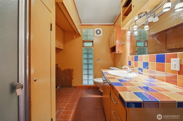 827 Hobson St, Walla Walla, WA 99362 - bathroom with toilet, vanity, and brick patterned flooring