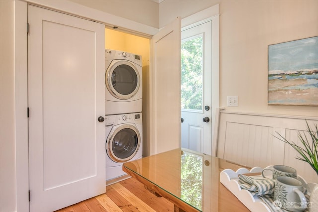 191 Compass St, Pacific Beach, WA 98571 - washroom featuring stacked washer / drying machine and light wood-style flooring