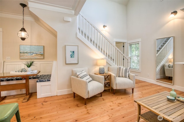 191 Compass St, Pacific Beach, WA 98571 - living area featuring stairs, light wood-style flooring, and a high ceiling