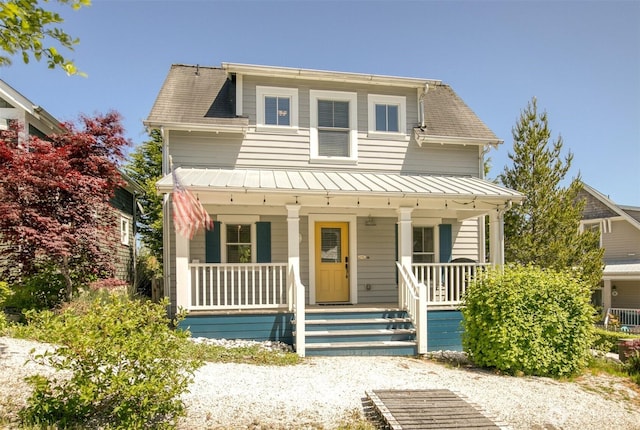 191 Compass St, Pacific Beach, WA 98571 - view of front facade with a standing seam roof, covered porch, and a metal roof