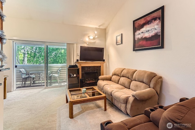 12429 NE 130th Ct NE Unit G304, Kirkland, WA 98034 - living room with lofted ceiling, a fireplace, and carpet