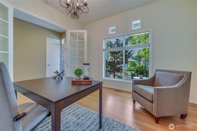 22879 NE 127th Way, Redmond, WA 98053 - office space featuring a chandelier, healthy amount of natural light, wood finished floors, and baseboards