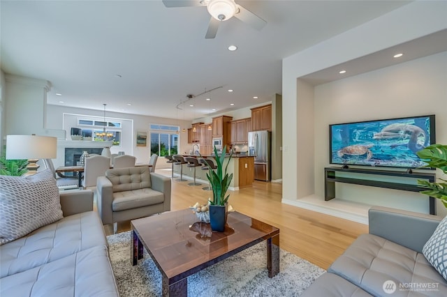 22879 NE 127th Way, Redmond, WA 98053 - living room featuring light wood-style floors, ceiling fan, and recessed lighting