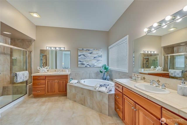 22879 NE 127th Way, Redmond, WA 98053 - full bathroom with two vanities, a stall shower, a bath, and tile patterned flooring