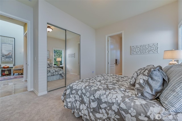 22879 NE 127th Way, Redmond, WA 98053 - bedroom with carpet flooring, a closet, and baseboards
