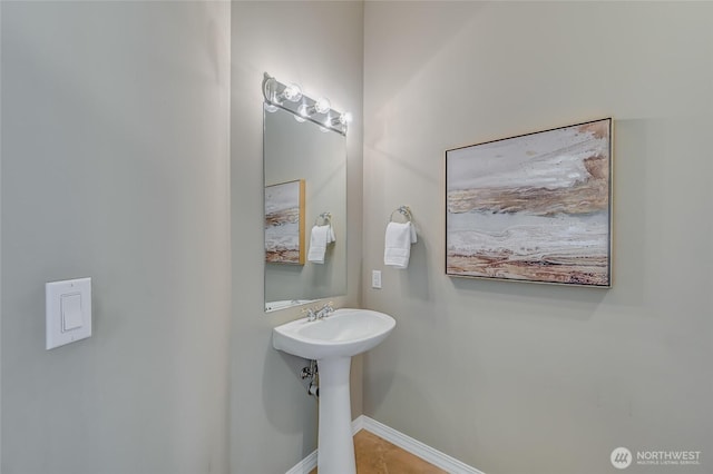22879 NE 127th Way, Redmond, WA 98053 - bathroom with baseboards, tile patterned flooring, and a sink