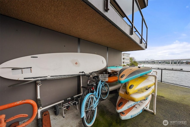 2360 43rd Ave E Unit 213, Seattle, WA 98112 - view of patio / terrace featuring a balcony and a water view